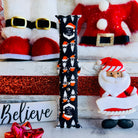 Don't Stop Believin' Apple Watch band styled with Santa Claus decorations and Christmas props
