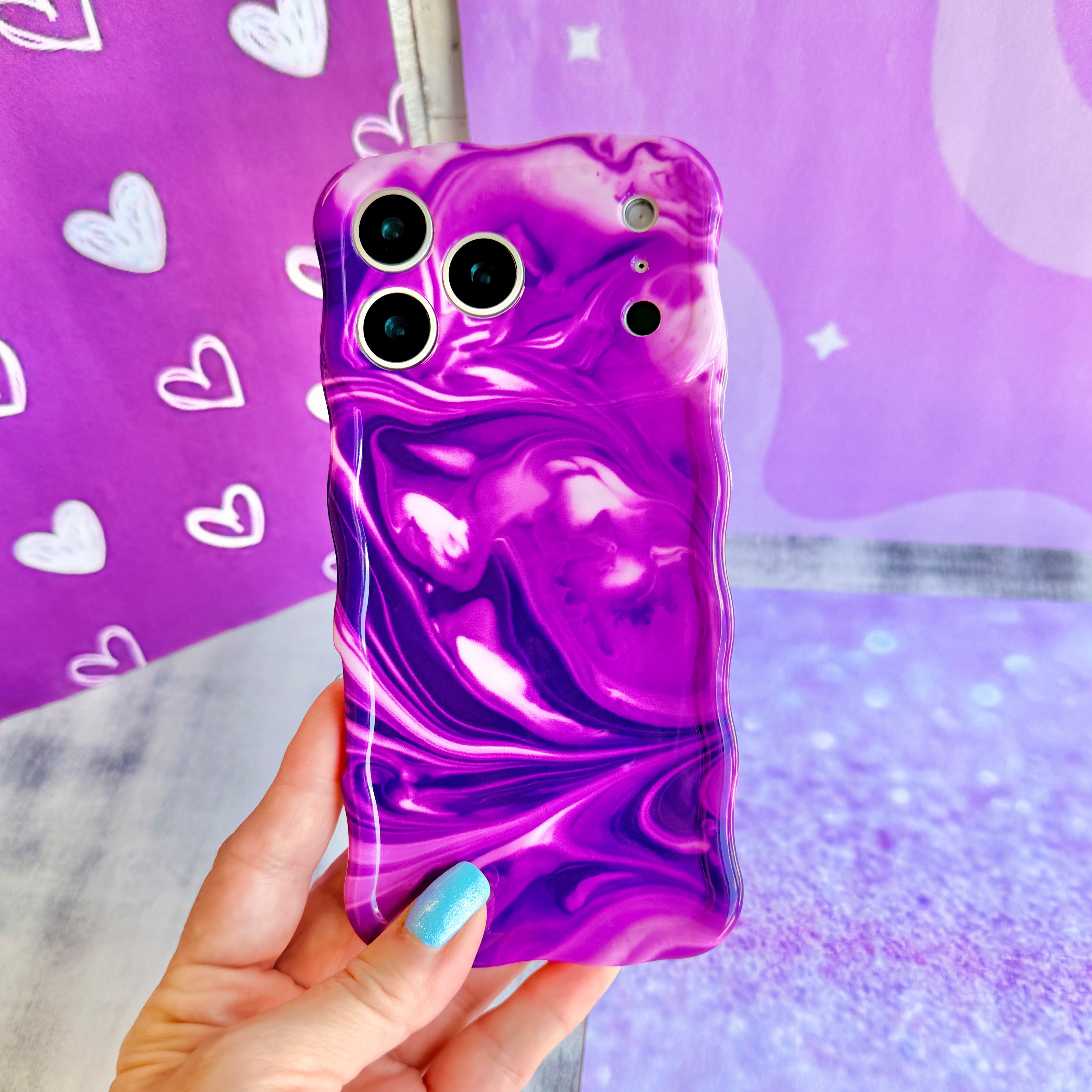 Grape Crush Wavy Luxe MagSafe iPhone case with a glossy purple liquid marble swirl design from Fancy Bands