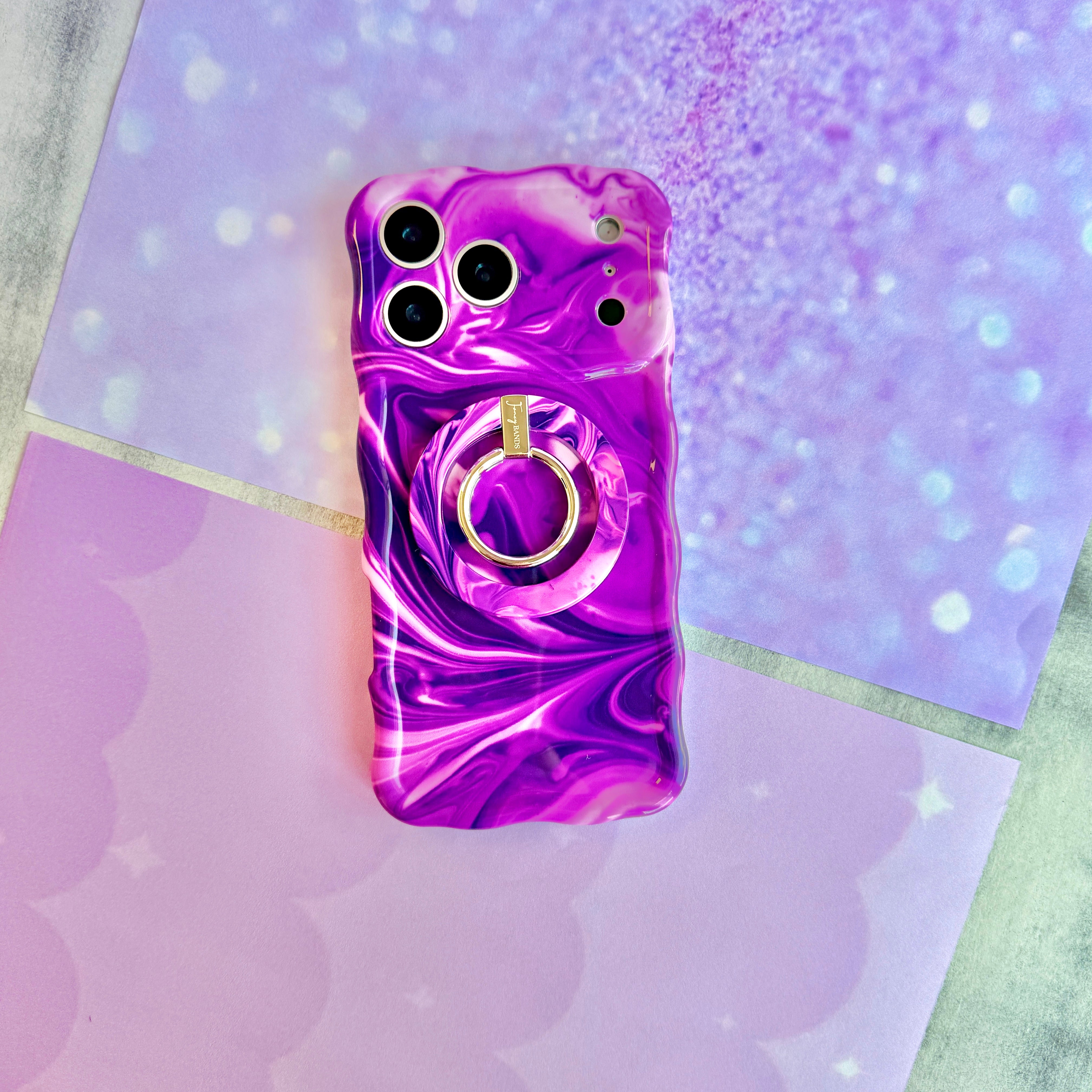 Grape Crush Hold It Fancy MagSafe grip ring with a glossy purple liquid marble swirl design from Fancy Bands