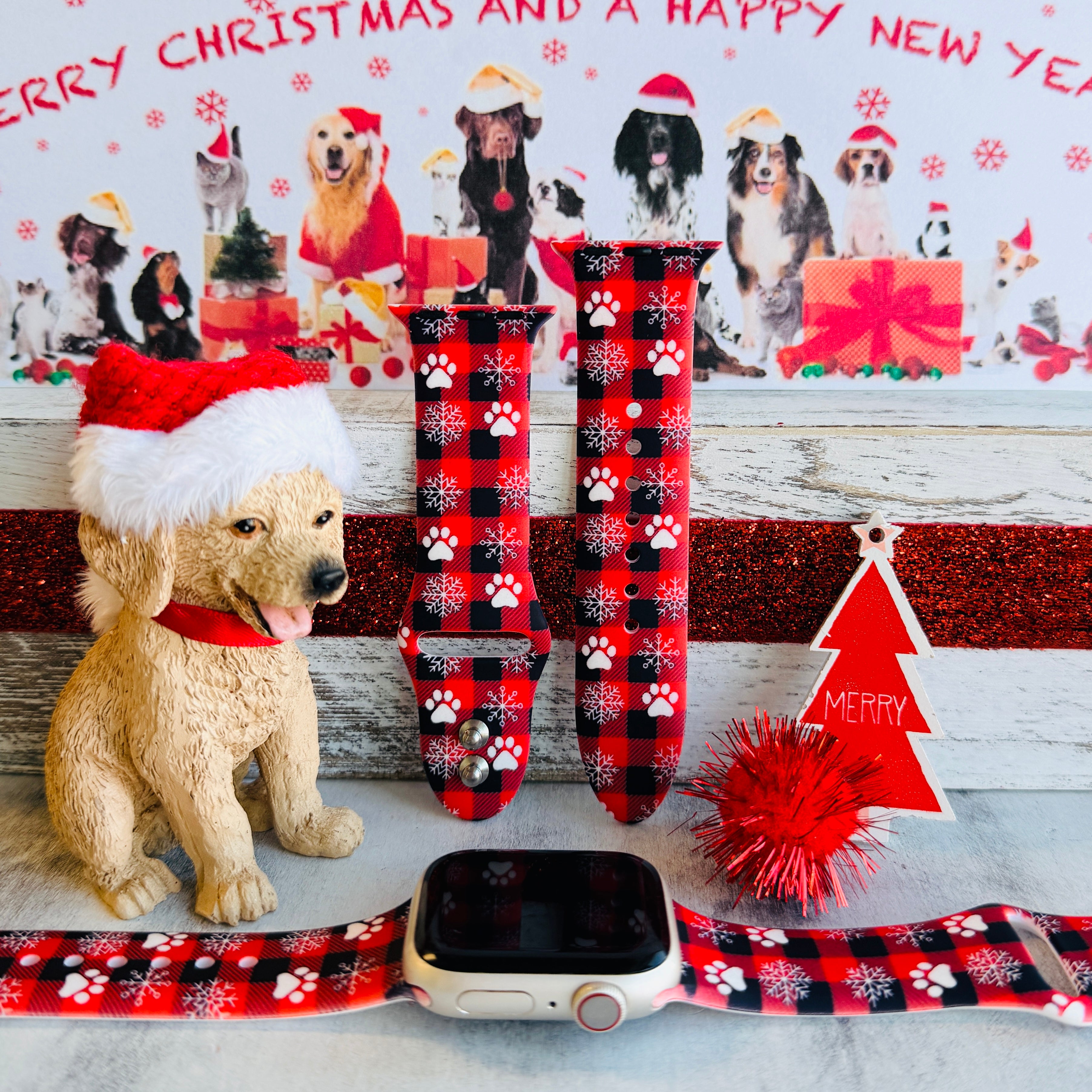 Pawliday Plaid Apple Watch band with paw prints and snowflakes on red buffalo check styled with dog Christmas decorations
