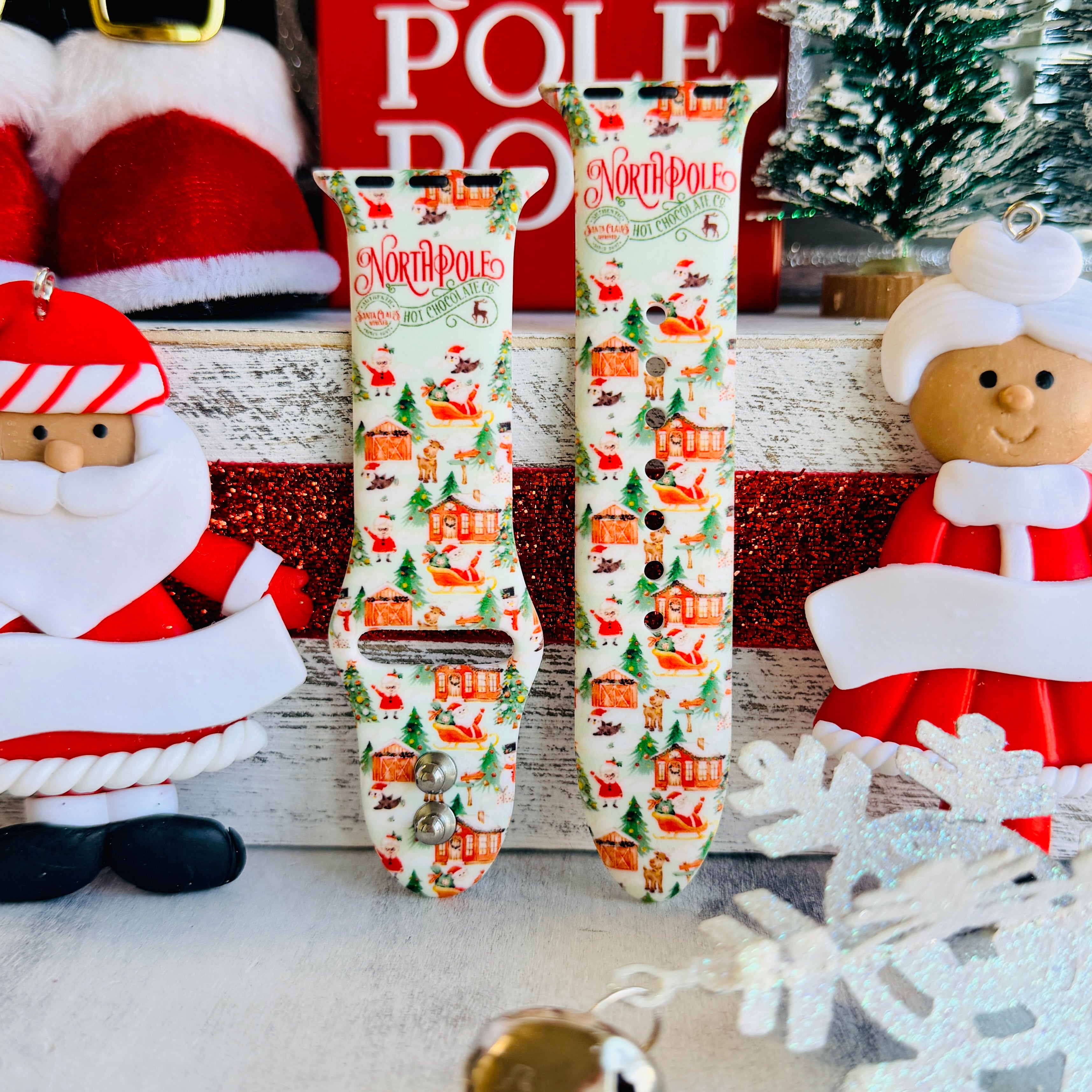 North Pole Apple Watch band displayed with Santa Claus decorations and festive North Pole props
