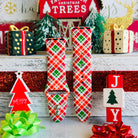 Merry Tartan plaid Apple Watch band styled with classic Christmas decorations and tartan accessories
