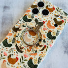 Cluckin' Cute Hold It Fancy MagSafe grip ring attached to the matching Cluckin' Cute iPhone case