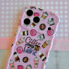 Pink phone case with coffee and donut designs on a checkered background