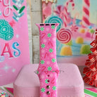 Close-up of the Peppermint Cutie Apple Watch band showing mint peppermints, candy canes and snowflakes on pink