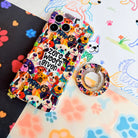 Zero Woofs Given Hold It Fancy MagSafe grip ring with a colorful illustrated dog print design from Fancy Bands