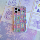 No Peeking, Darling iPhone case lying flat on lavender snowflake paper beside Merry & Bright and Tis the Season holiday cards