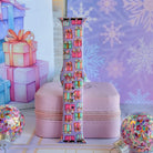 No Peeking, Darling Apple Watch band buckled and standing on a pink jewelry box between glitter ornaments