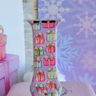 Close-up of a single No Peeking, Darling Apple Watch band strap, pastel presents with gold bows on lavender