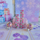 Both straps of the No Peeking, Darling silicone Samsung Galaxy Watch band on a pink jewelry box with confetti ornaments