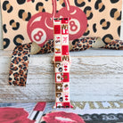 Wild Cherry Apple Watch band with retro checkerboard pattern featuring cherries, lips, and leopard print in red and cream
