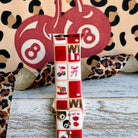 Wild Cherry Apple Watch band with retro checkerboard pattern featuring cherries, lips, and leopard print in red and cream
