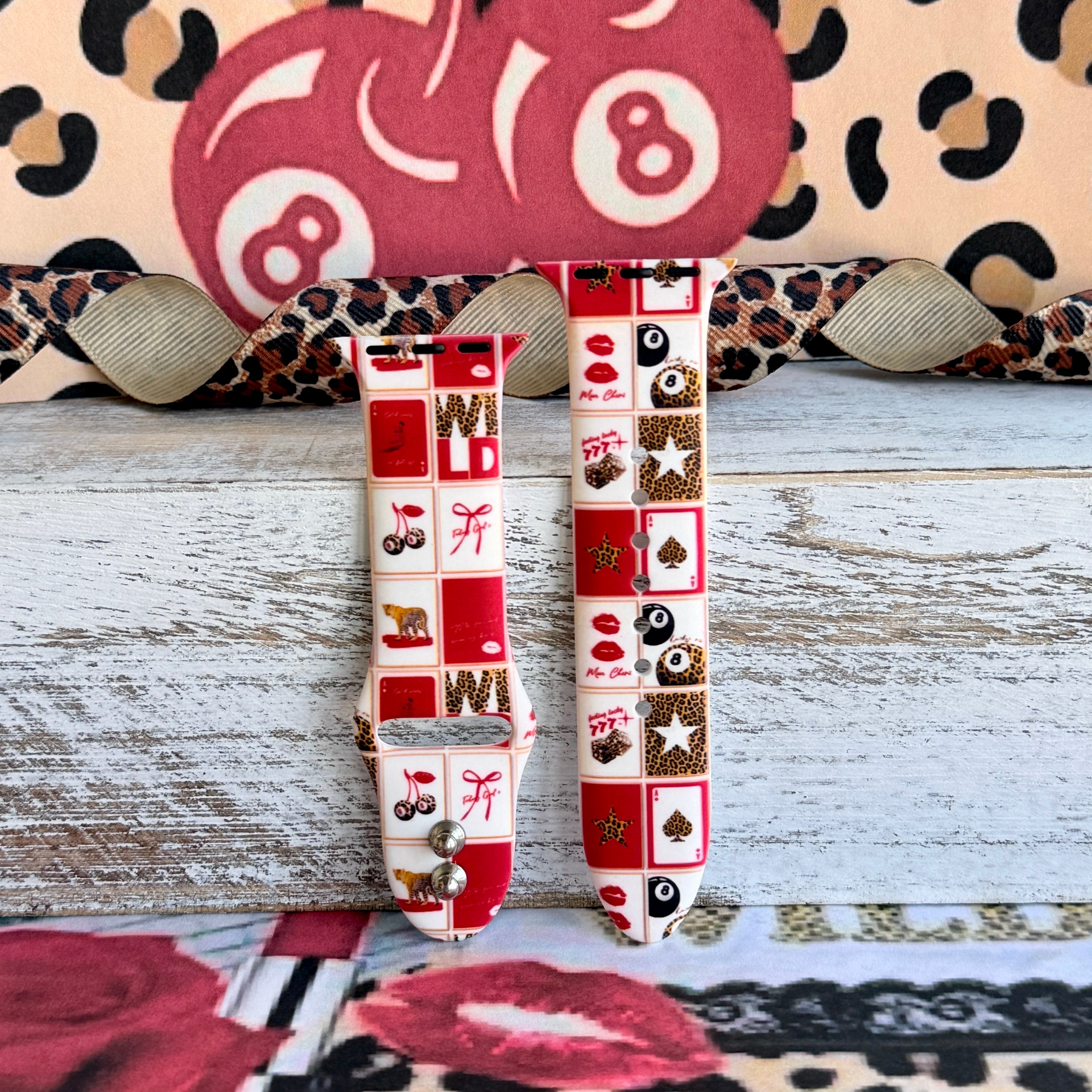 Wild Cherry Apple Watch band with retro checkerboard pattern featuring cherries, lips, and leopard print in red and cream
