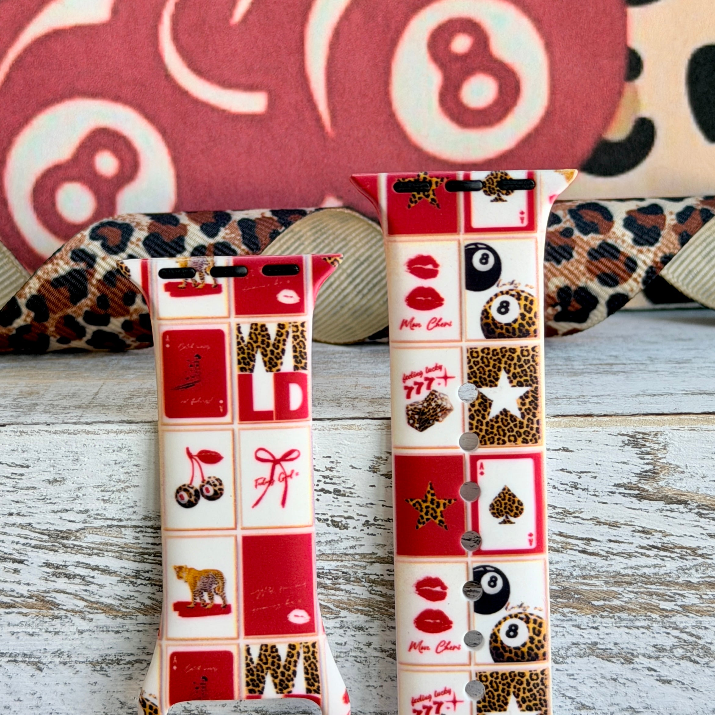 Wild Cherry Apple Watch band with retro checkerboard pattern featuring cherries, lips, and leopard print in red and cream
