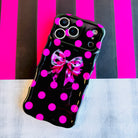 Sweet Spot MagSafe iPhone case with hot pink polka dots and cowhide bow on black by Fancy Bands
