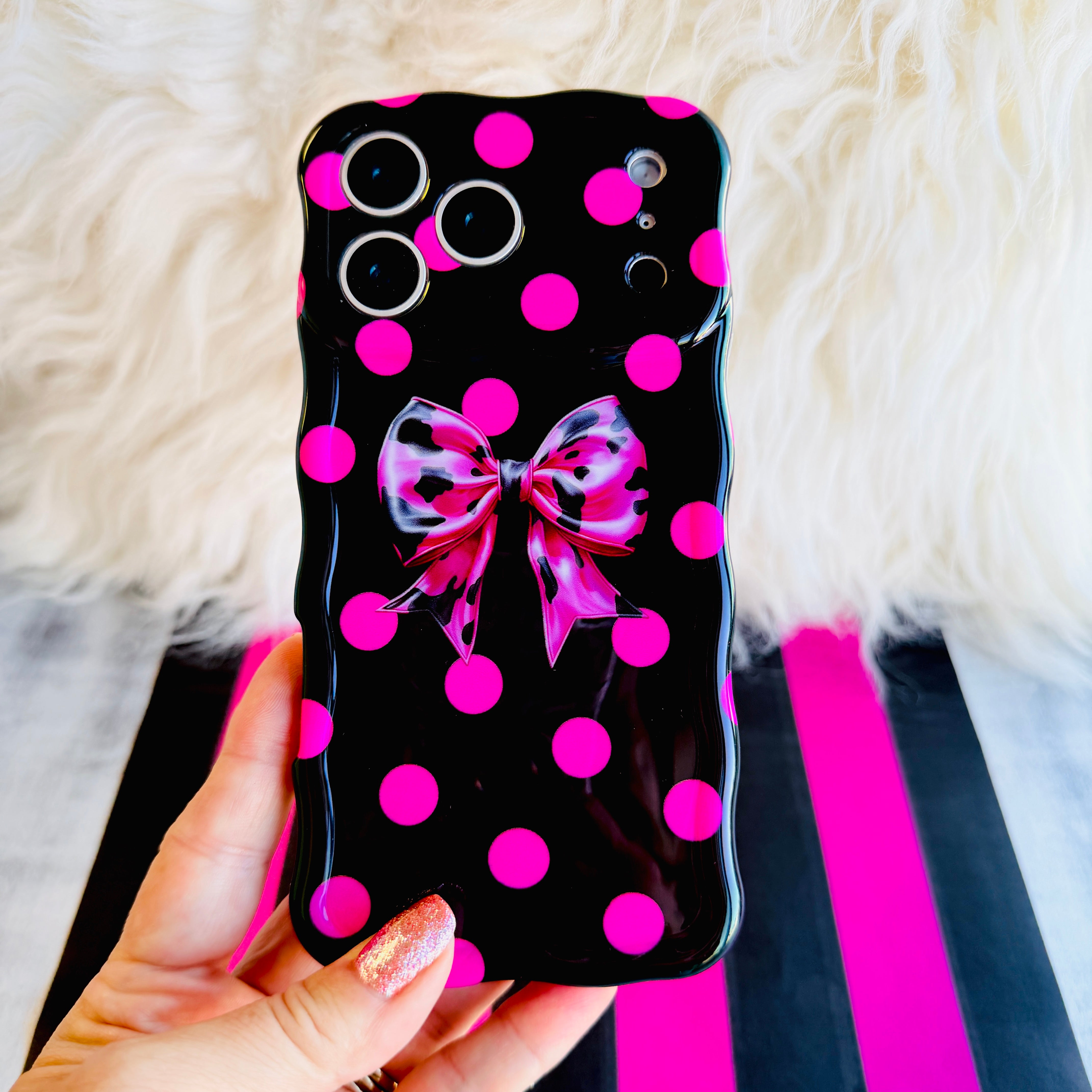 Sweet Spot MagSafe iPhone case with hot pink polka dots and cowhide bow on black by Fancy Bands
