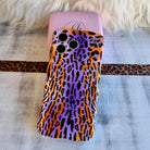 Purr-ple Haze MagSafe iPhone case with purple and orange leopard print by Fancy Bands
