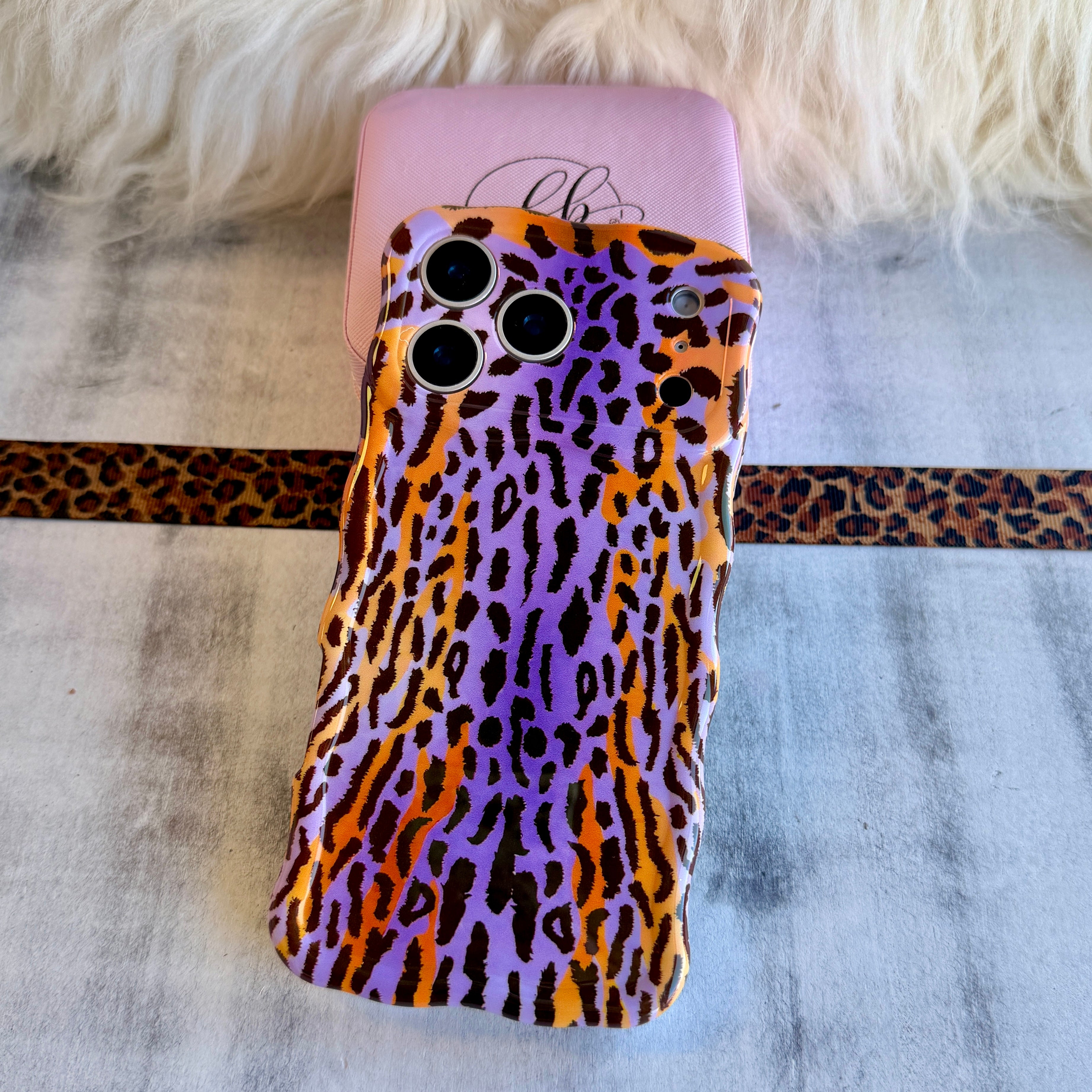 Purr-ple Haze MagSafe iPhone case with purple and orange leopard print by Fancy Bands
