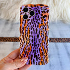 Purr-ple Haze MagSafe iPhone case with purple and orange leopard print by Fancy Bands

