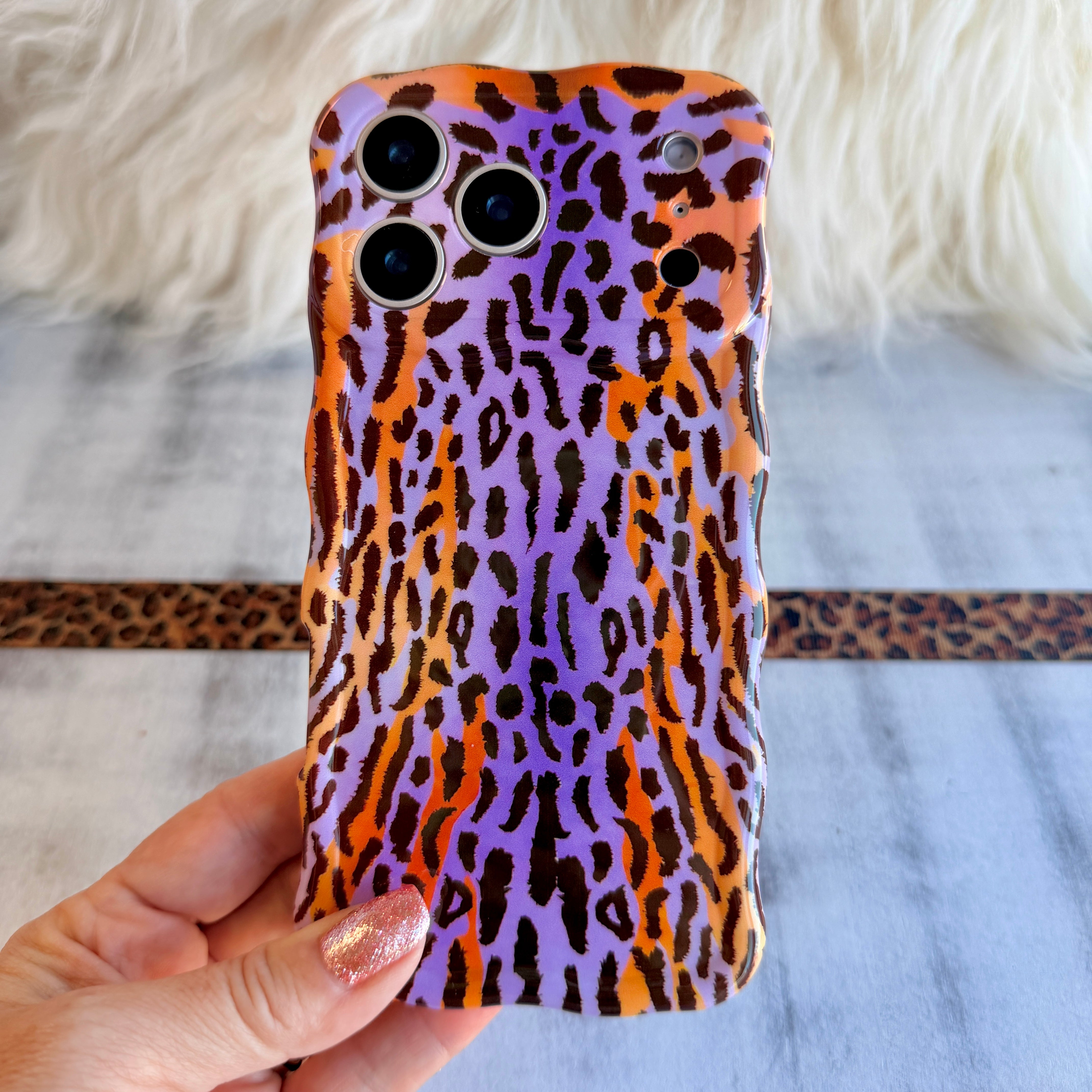 Purr-ple Haze MagSafe iPhone case with purple and orange leopard print by Fancy Bands
