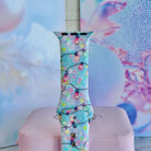 Close-up of a single Twinkle All The Way Apple Watch band strap, pastel Christmas bulbs on aqua