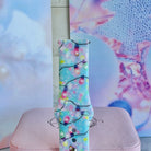 Close-up of a single Twinkle All The Way Samsung watch band strap, pastel Christmas bulbs on aqua