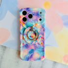 Pastel Paradise iridescent floral MagSafe phone grip ring with glowing lavender blue and coral petals compatible with iPhone and Samsung