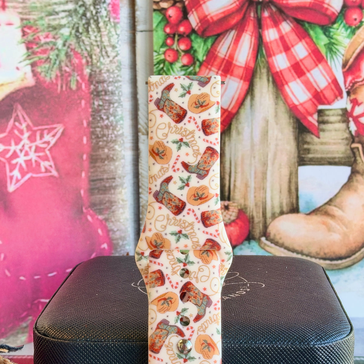 Close-up of a single Boot Scootin' Christmas Samsung watch band strap, western Christmas print on cream