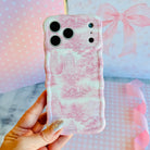 Trendy blush pink and white wavy iPhone case featuring a classical Toile de Jouy estate and landscape pattern with a high-gloss finish.
