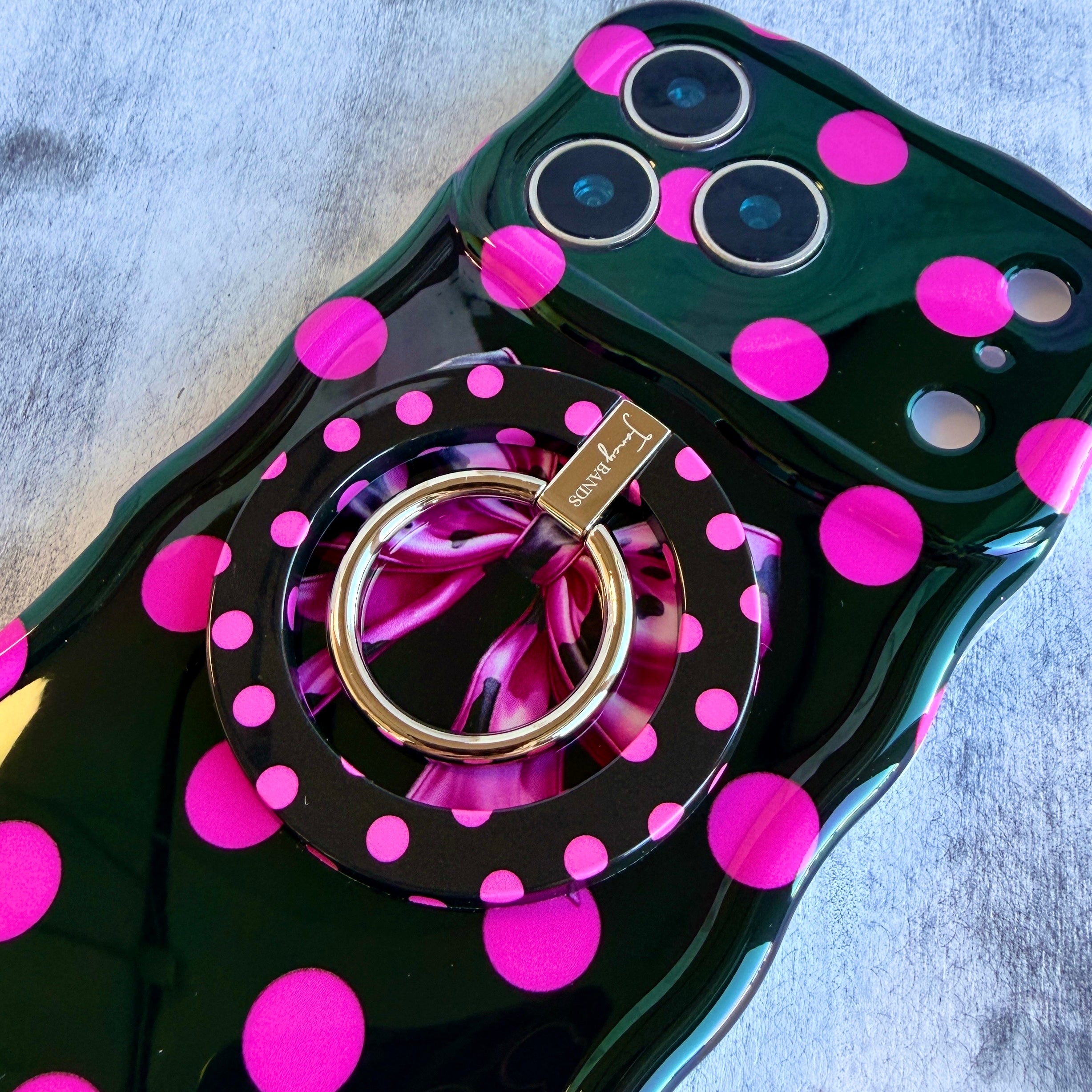 Sweet Spot black and pink polka dot MagSafe phone grip ring and stand compatible with iPhone and Samsung