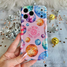 Pink wavy iPhone case featuring colorful retro disco balls and the quote Less Bitter More Glitter, held in hand with MagSafe compatibility.
