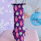 Close-up of a single Just One More Ornament Apple Watch band strap, purple Christmas ornament print