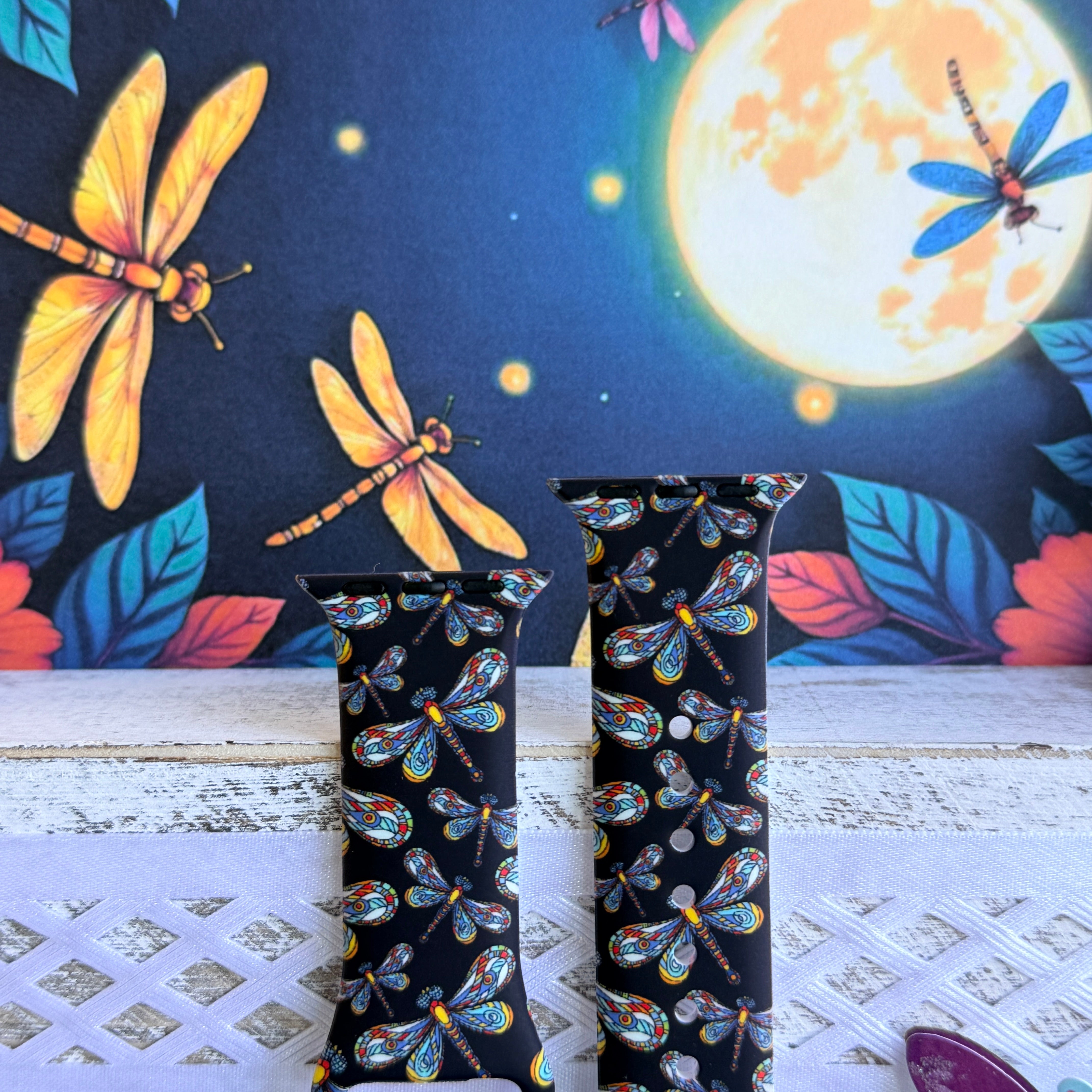 Dragonfly Dreams Apple Watch band with colorful paisley-wing dragonflies on black background with moon and nature backdrop
