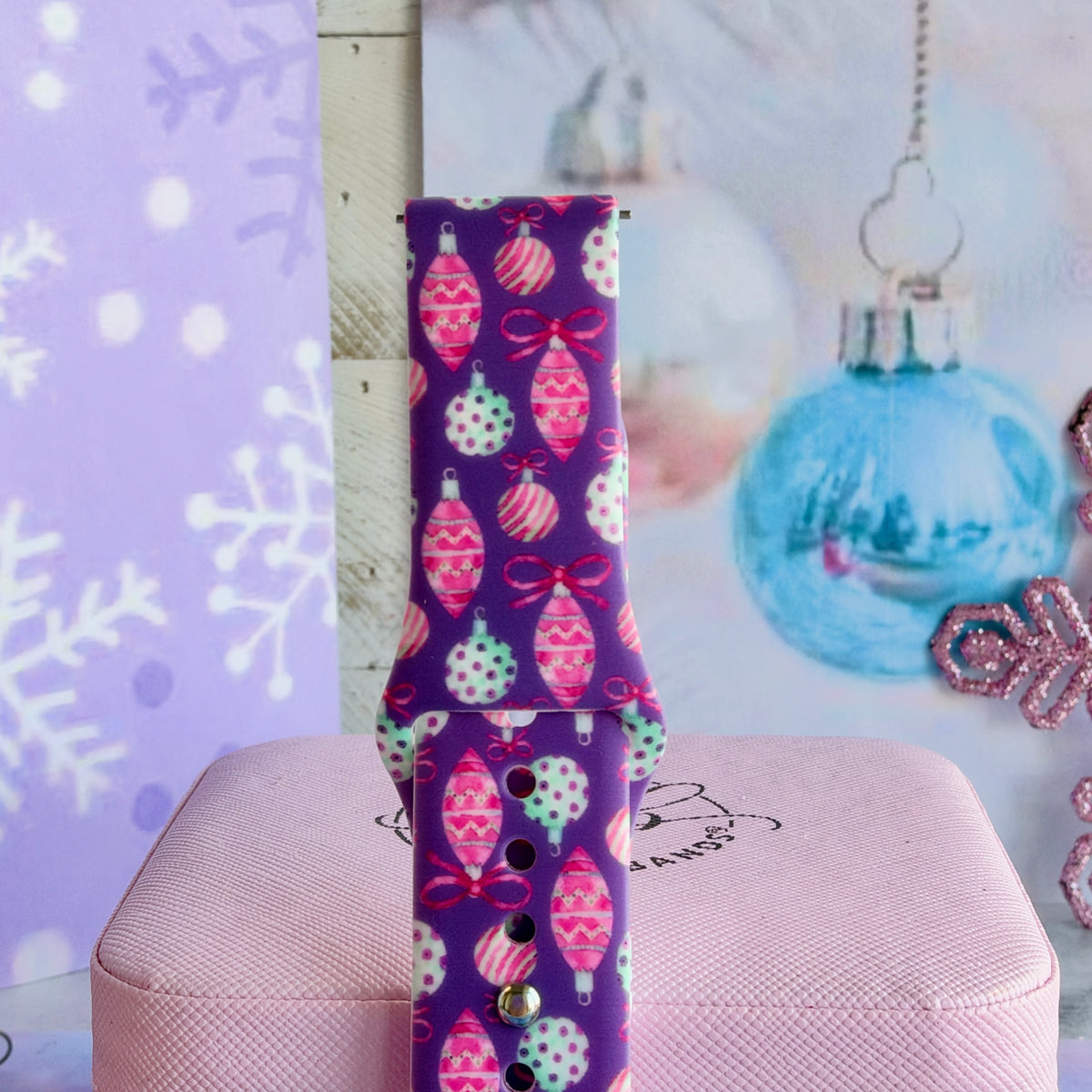Close-up of a buckled Just One More Ornament Samsung Galaxy Watch band, purple Christmas ornament print