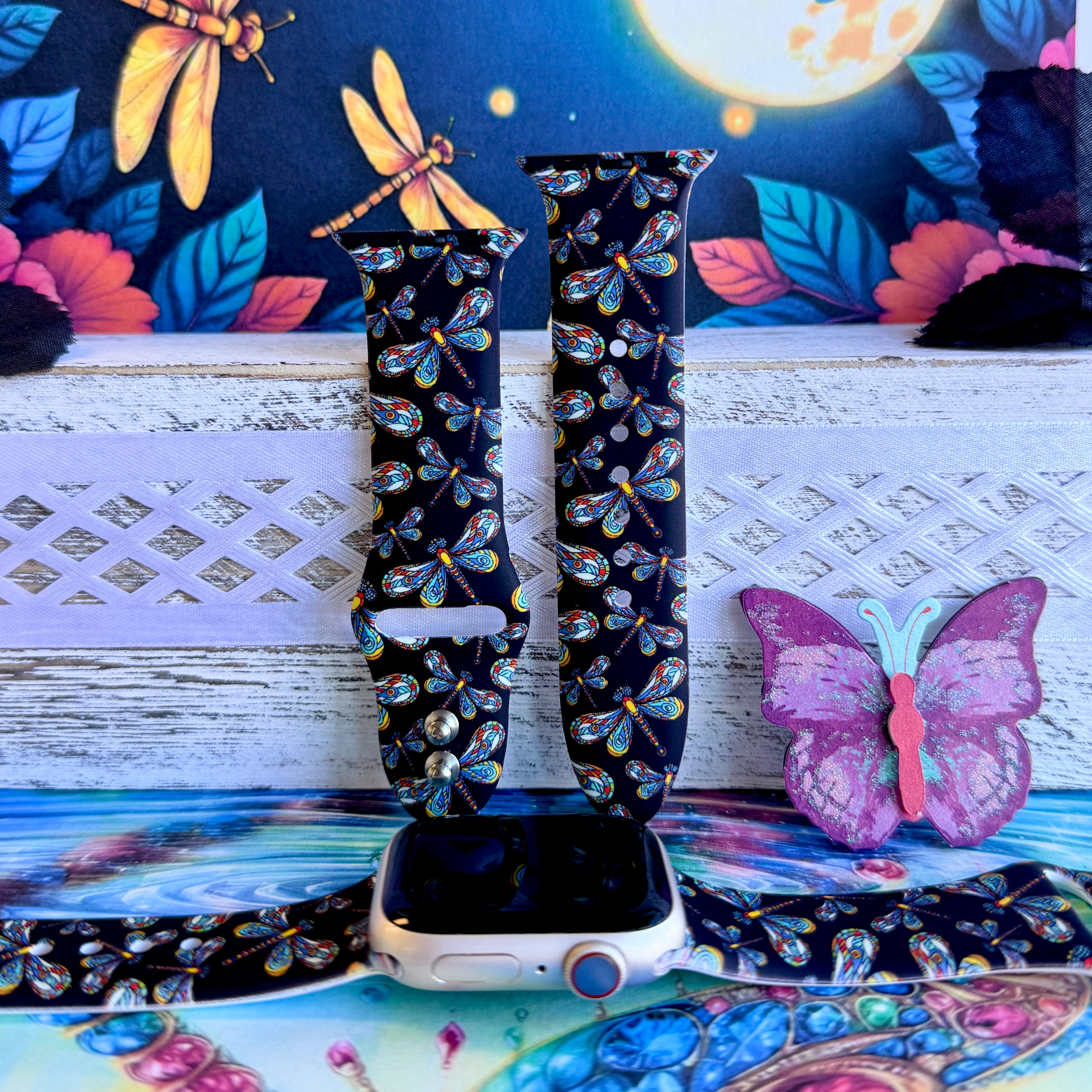 Dragonfly Dreams Apple Watch band with colorful paisley-wing dragonflies on black background with moon and nature backdrop

