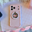 Silently Judging You soft pink MagSafe phone grip ring with small black polka dots compatible with iPhone and Samsung
