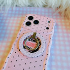 Silently Judging You soft pink MagSafe phone grip ring with small black polka dots compatible with iPhone and Samsung