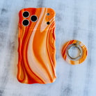 Orange Crush bright abstract orange swirl pattern MagSafe phone grip ring and stand compatible with iPhone and Samsung