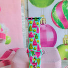 Close-up of a single Merry & Bright, Totally! Apple Watch band strap, pink and green Christmas tree print on aqua