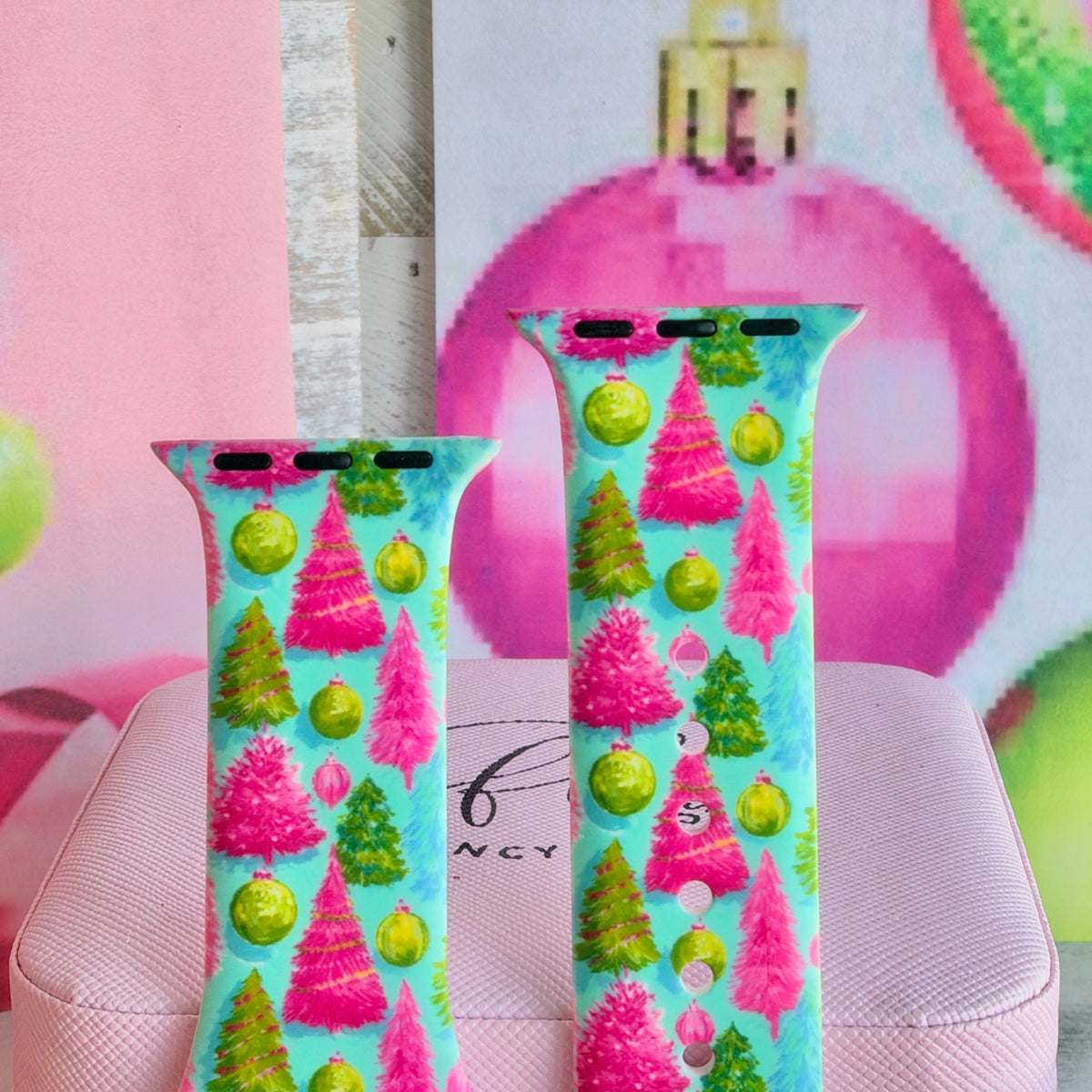 Close-up of both Merry & Bright, Totally! Apple Watch band straps with hot pink and lime bottle-brush trees and lime ornaments