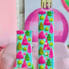 Close-up of both Merry & Bright, Totally! Samsung Galaxy Watch band straps with hot pink and lime Christmas trees on aqua