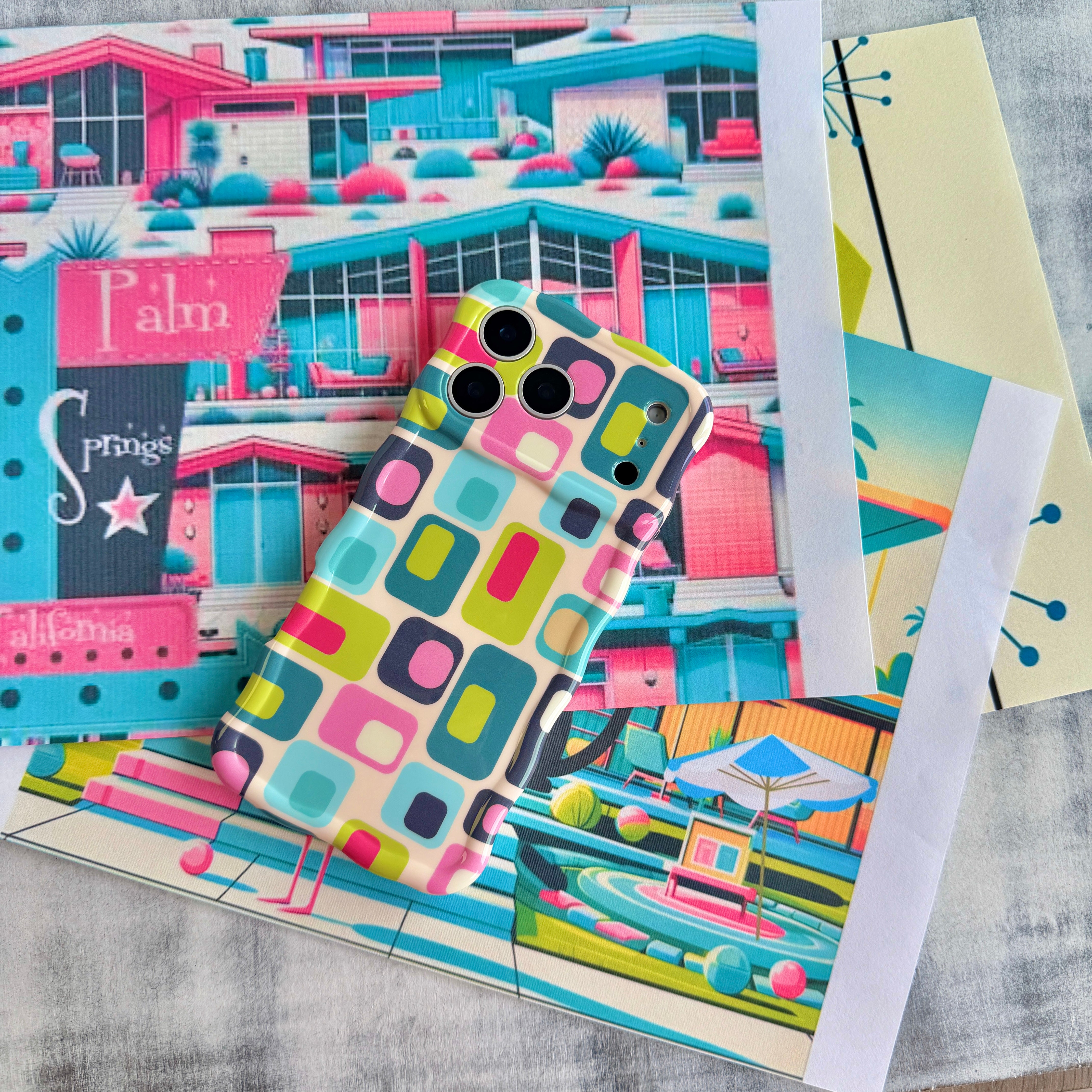 Trendy wavy iPhone case featuring a teal, pink, and lime green Mid-Century Modern geometric pattern with a high-gloss finish.