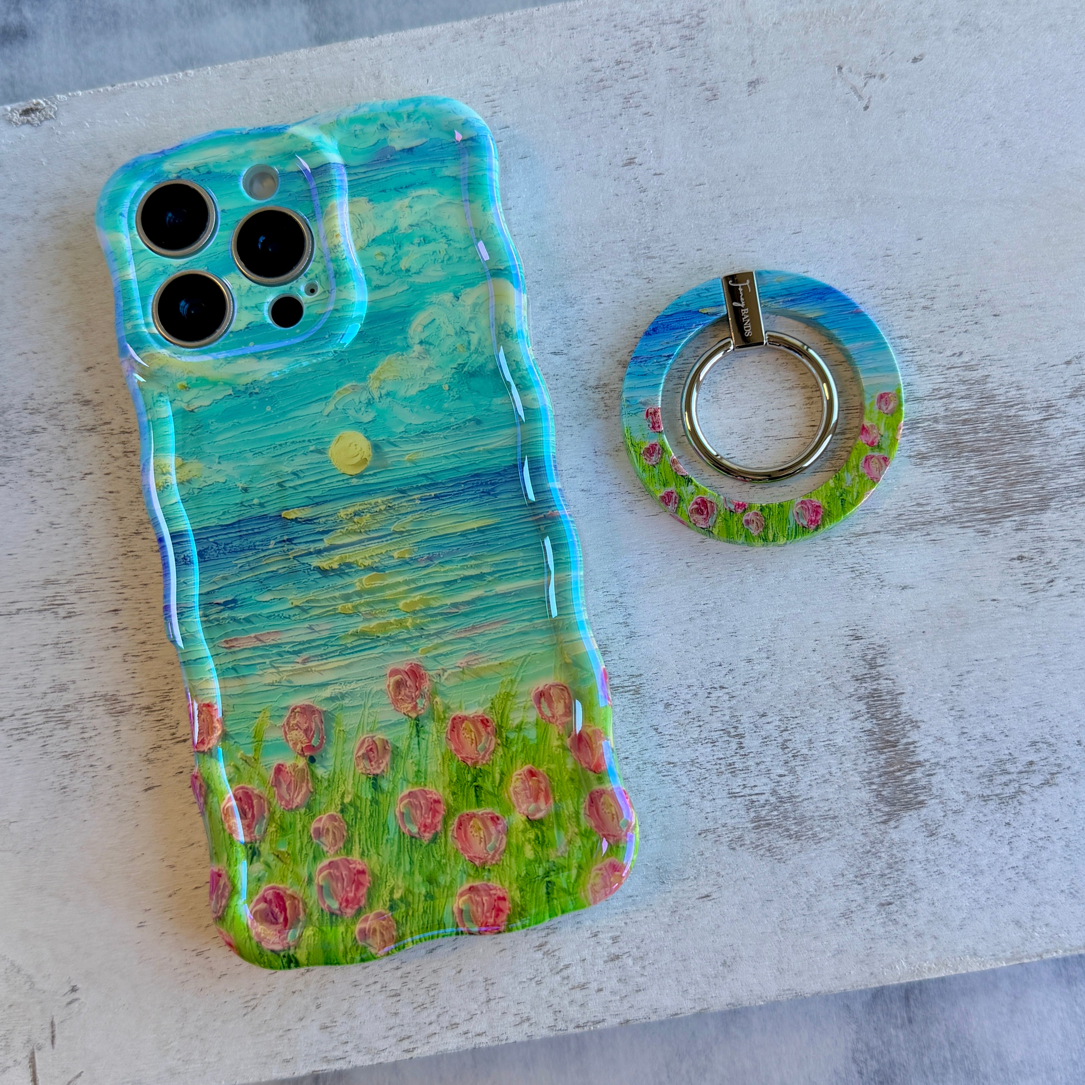 Coastal Bloom oil painting style MagSafe phone grip ring with blue sky and pink wildflowers compatible with iPhone and Samsung