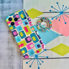 Mod Mood retro mid-century geometric MagSafe phone grip ring with teal lime pink and navy color blocks compatible with iPhone and Samsung