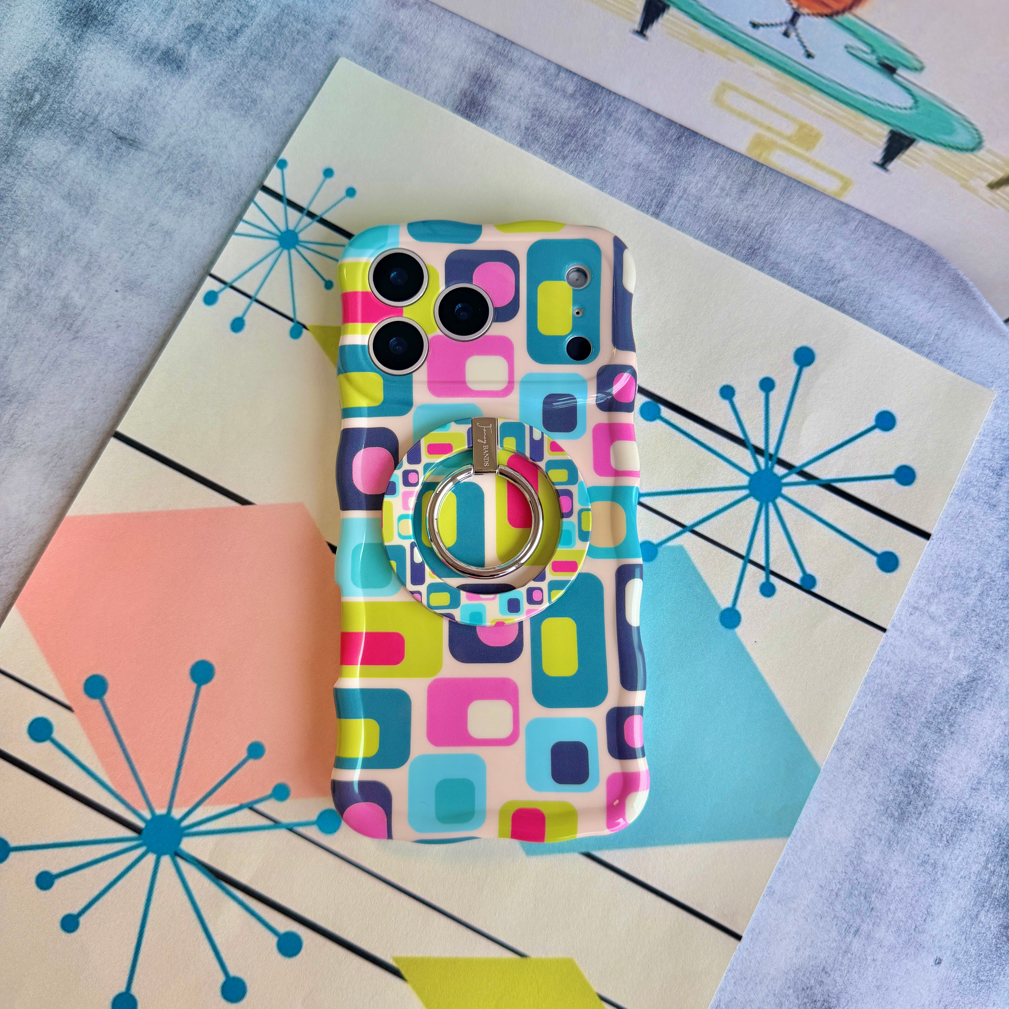 Trendy wavy iPhone case featuring a teal, pink, and lime green Mid-Century Modern geometric pattern with a high-gloss finish.