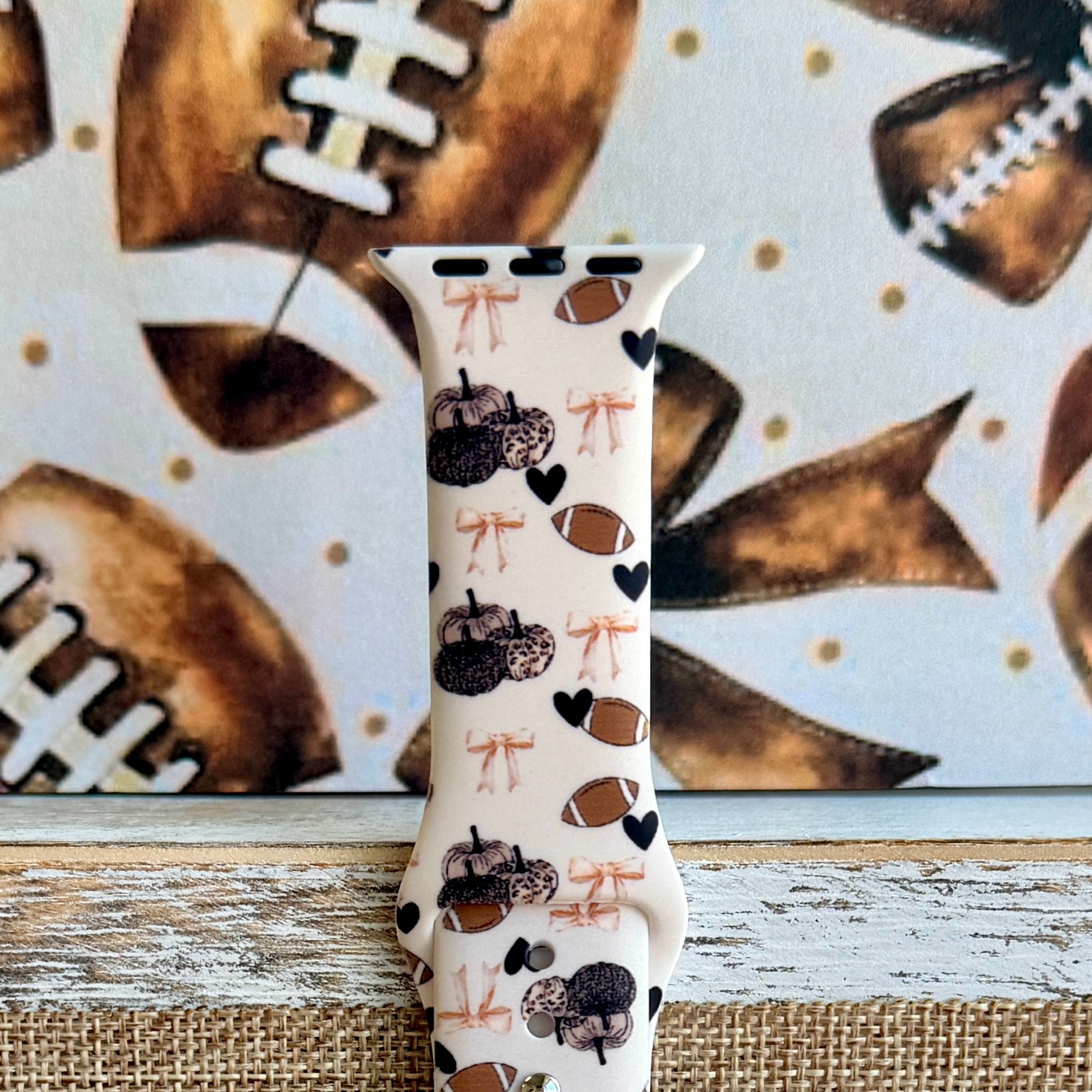 Game Day Darling coquette football print silicone band for Apple Watch with footballs, pumpkins, bows and hearts from Fancy Bands