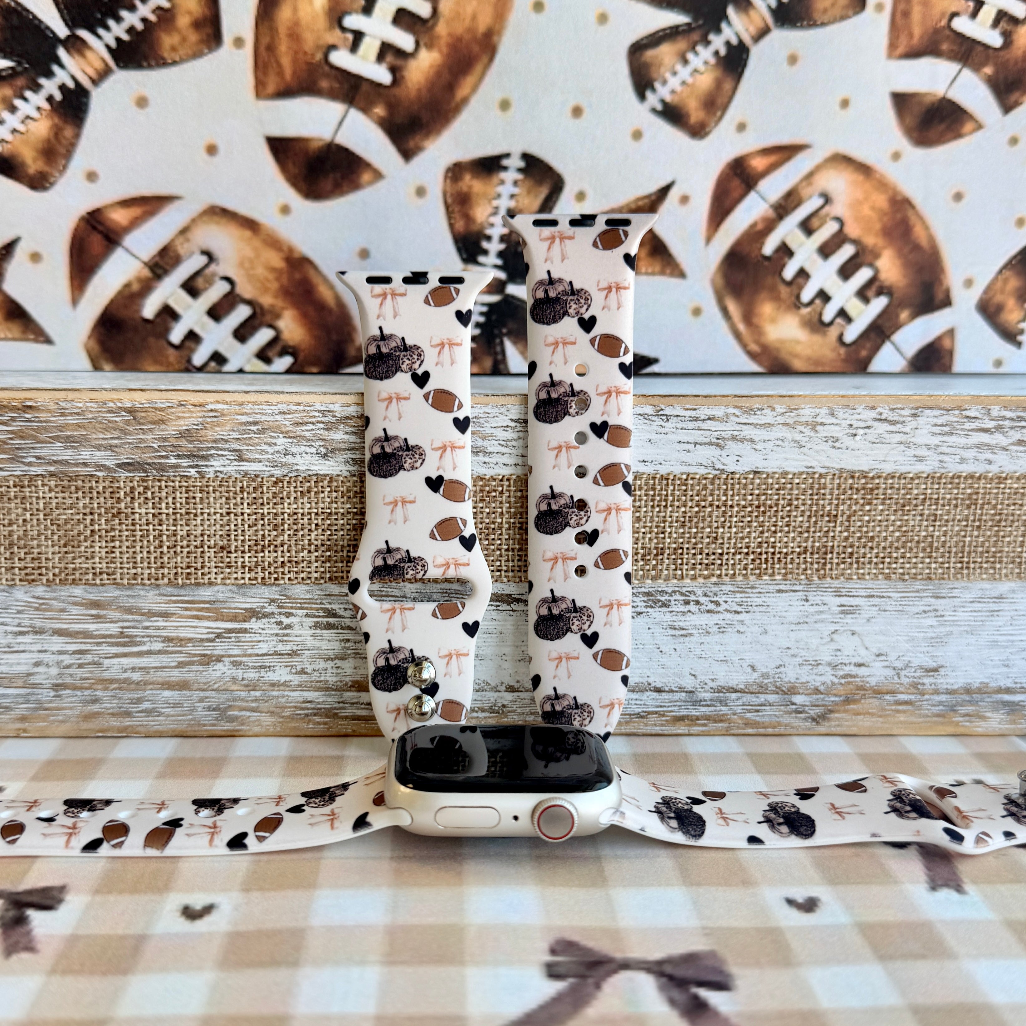 Game Day Darling coquette football print silicone band for Apple Watch with footballs, pumpkins, bows and hearts from Fancy Bands