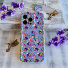 Lavender wavy iPhone case featuring colorful hummingbirds, purple flowers, and the quote Find Your Joy In The Little Things.
