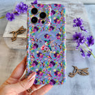 Lavender wavy iPhone case featuring colorful hummingbirds, purple flowers, and the quote Find Your Joy In The Little Things.