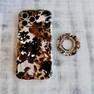 Rodeo Wild western cowhide pattern MagSafe phone grip ring with brown and black spots compatible with iPhone and Samsung